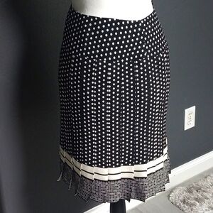 Pleated black and white polka dot skirt